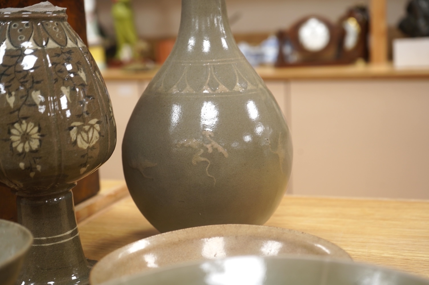 Five pieces of Chinese/Korean celadon comprising three bowls and two vases, 31cm high. Condition - some breaks